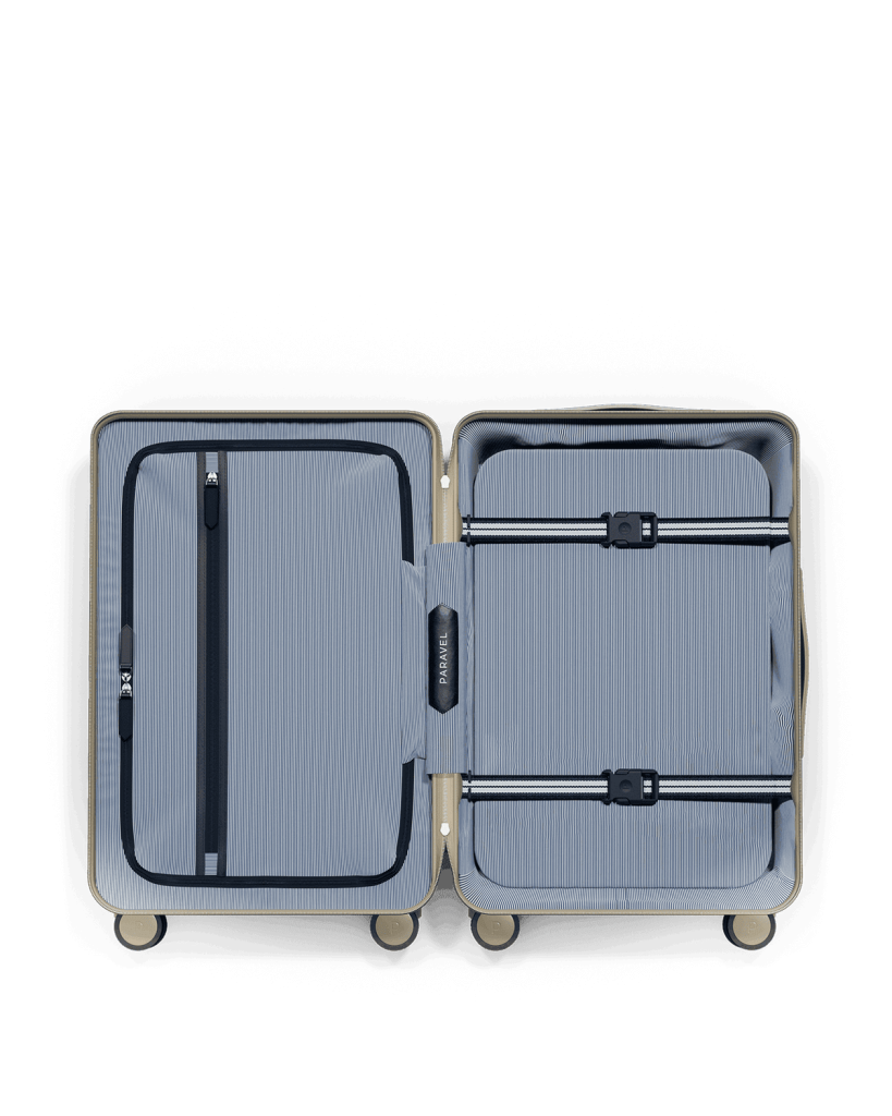 Paravel Aviator Carry-On interior Inside the Paravel Aviator Carry-On: recycled striped lining, zippered divider, compression board and webbing straps with clips